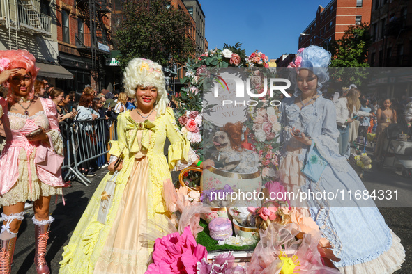 A dog and its owners dress in Baroque style with big gowns, big hair, and corsets for the 34th Annual Tompkins Square Halloween Dog Parade i...