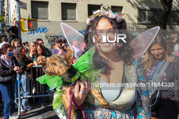 A dog and owner dress as fairies for the 34th Annual Tompkins Square Halloween Dog Parade in Tompkins Square Park in New York City, USA, on...