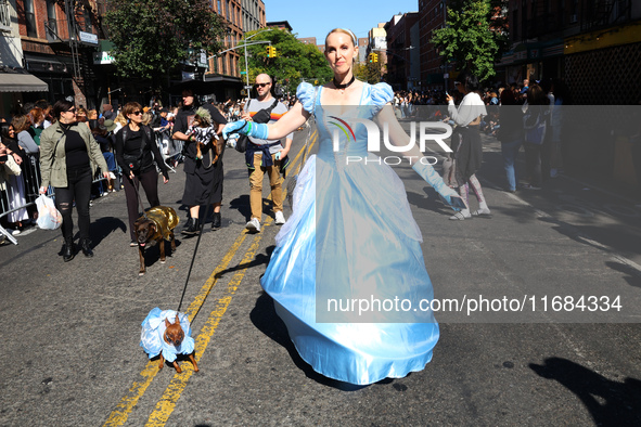 A dog and its owner dress as fairy princesses for the 34th Annual Tompkins Square Halloween Dog Parade in Tompkins Square Park in New York C...