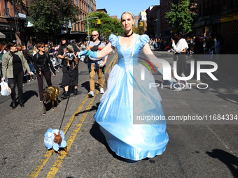 A dog and its owner dress as fairy princesses for the 34th Annual Tompkins Square Halloween Dog Parade in Tompkins Square Park in New York C...