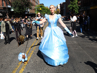 A dog and its owner dress as fairy princesses for the 34th Annual Tompkins Square Halloween Dog Parade in Tompkins Square Park in New York C...