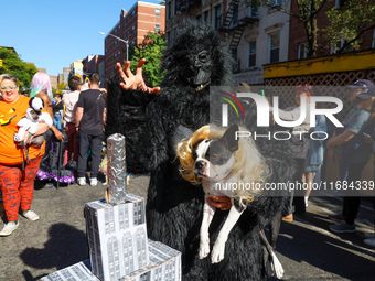 A dog and owner dress as King Kong and Fay Wray with the Empire State Building for the 34th Annual Tompkins Square Halloween Dog Parade in T...