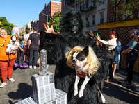 A dog and owner dress as King Kong and Fay Wray with the Empire State Building for the 34th Annual Tompkins Square Halloween Dog Parade in T...