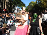 A dog and its owners pay tribute to the Wizard of Oz as they march during the 34th Annual Tompkins Square Halloween Dog Parade in Tompkins S...