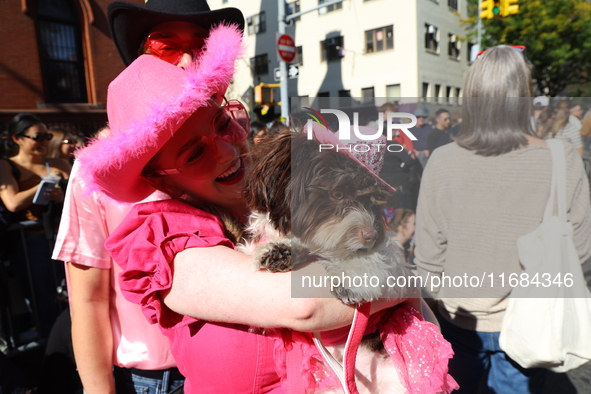 A dog and its owner dress as cowgirls for the 34th Annual Tompkins Square Halloween Dog Parade in Tompkins Square Park in New York City, USA...