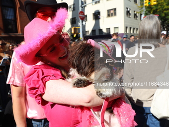 A dog and its owner dress as cowgirls for the 34th Annual Tompkins Square Halloween Dog Parade in Tompkins Square Park in New York City, USA...