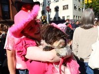 A dog and its owner dress as cowgirls for the 34th Annual Tompkins Square Halloween Dog Parade in Tompkins Square Park in New York City, USA...