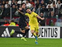 Dusan Vlahovic of Juventus F.C. and Mario Gila of S.S. Lazio are in action during the 8th day of the Serie A Championship between Juventus F...