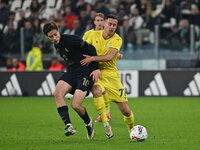 Kenan Yildiz of Juventus F.C. and Adam Marusic of S.S. Lazio are in action during the 8th day of the Serie A Championship between Juventus F...