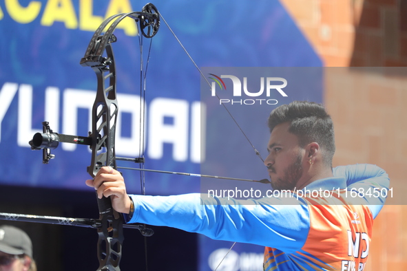 Prathamesh Balchandra Fuge of India competes against Mike Schloesser of the Netherlands (not in picture) during the men's compound bronze me...