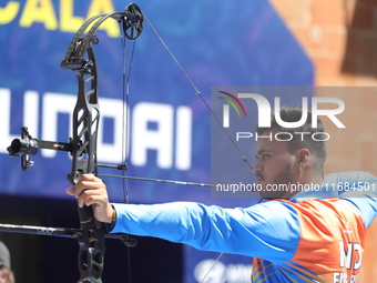 Prathamesh Balchandra Fuge of India competes against Mike Schloesser of the Netherlands (not in picture) during the men's compound bronze me...