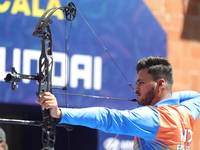 Prathamesh Balchandra Fuge of India competes against Mike Schloesser of the Netherlands (not in picture) during the men's compound bronze me...