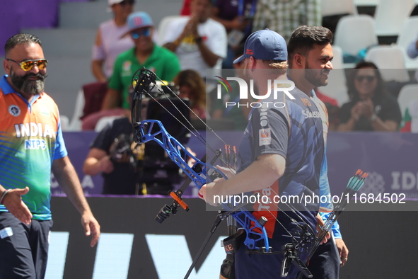 Prathamesh Balchandra Fuge of India and Mike Schloesser of the Netherlands compete during the men's compound bronze medal match on the secon...