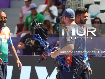 Prathamesh Balchandra Fuge of India and Mike Schloesser of the Netherlands compete during the men's compound bronze medal match on the secon...