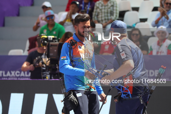 Prathamesh Balchandra Fuge of India and Mike Schloesser of the Netherlands compete during the men's compound bronze medal match on the secon...