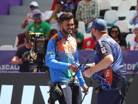 Prathamesh Balchandra Fuge of India and Mike Schloesser of the Netherlands compete during the men's compound bronze medal match on the secon...