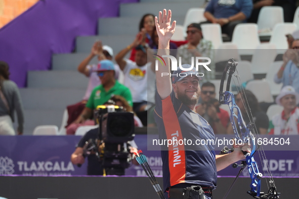 Mike Schloesser of the Netherlands competes against Prathamesh Balchandra Fuge of India (not in picture) during the men's compound bronze me...