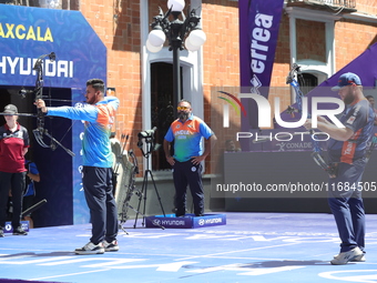 Prathamesh Balchandra Fuge of India and Mike Schloesser of the Netherlands compete during the men's compound bronze medal match on the secon...