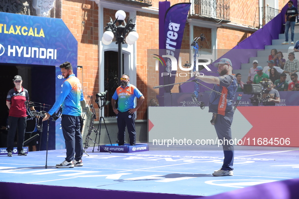 Prathamesh Balchandra Fuge of India and Mike Schloesser of the Netherlands compete during the men's compound bronze medal match on the secon...