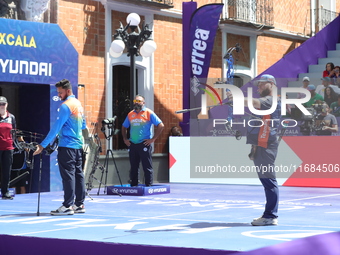 Prathamesh Balchandra Fuge of India and Mike Schloesser of the Netherlands compete during the men's compound bronze medal match on the secon...