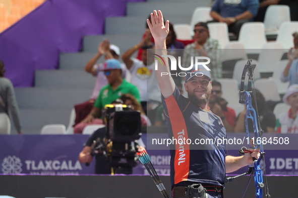 Mike Schloesser of the Netherlands competes against Prathamesh Balchandra Fuge of India (not in picture) during the men's compound bronze me...