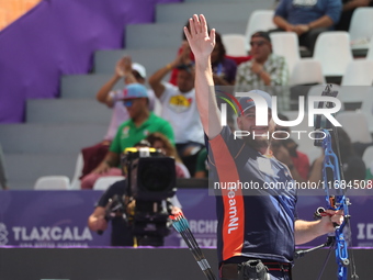 Mike Schloesser of the Netherlands competes against Prathamesh Balchandra Fuge of India (not in picture) during the men's compound bronze me...