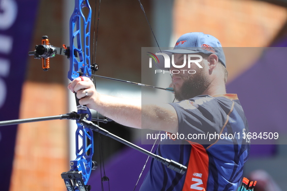 Mike Schloesser of the Netherlands competes against Prathamesh Balchandra Fuge of India (not in picture) during the men's compound bronze me...