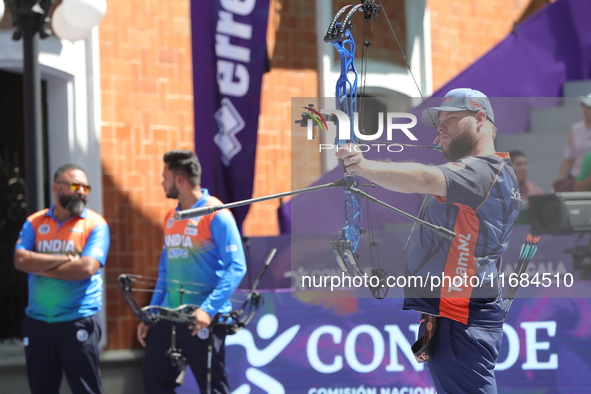 Mike Schloesser of the Netherlands competes against Prathamesh Balchandra Fuge of India (not in picture) during the men's compound bronze me...