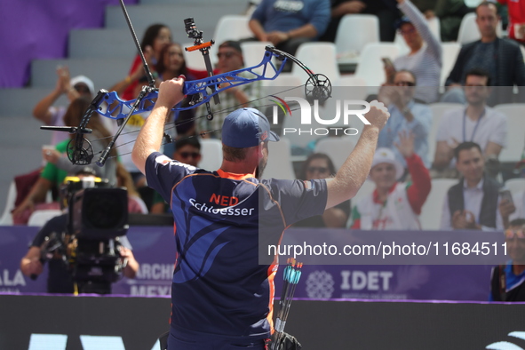 Mike Schloesser of the Netherlands competes against Prathamesh Balchandra Fuge of India (not in picture) during the men's compound bronze me...