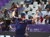 Mike Schloesser of the Netherlands competes against Prathamesh Balchandra Fuge of India (not in picture) during the men's compound bronze me...