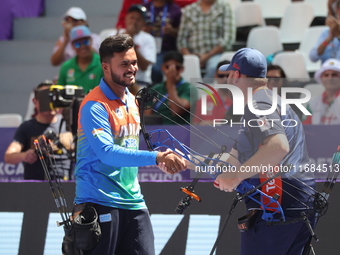 Prathamesh Balchandra Fuge of India and Mike Schloesser of the Netherlands compete during the men's compound bronze medal match on the secon...