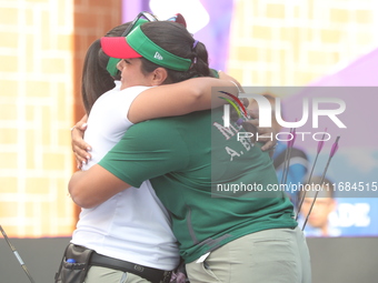 Andrea Maya Becerra of Mexico and Dafne Quintero of Mexico compete during the women's compound bronze medal match on the second day of the T...