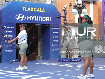 Andrea Maya Becerra of Mexico and Dafne Quintero of Mexico compete during the women's compound bronze medal match on the second day of the T...