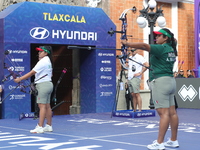 Andrea Maya Becerra of Mexico and Dafne Quintero of Mexico compete during the women's compound bronze medal match on the second day of the T...