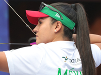 Dafne Quintero of Mexico competes against Andrea Maya Becerra of Mexico (not in picture) during the women's compound bronze medal match on t...