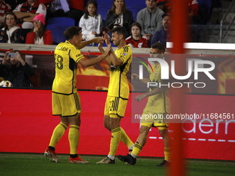 Columbus FC's Yevhen Cheberko (21) celebrates the winning goal with teammates during the MLS League match between Columbus FC and New York R...