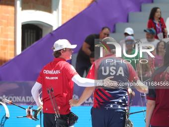 James Lutz of the United States and Mathias Fullerton of Denmark compete during the men's compound gold medal match on the second day of the...