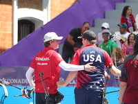 James Lutz of the United States and Mathias Fullerton of Denmark compete during the men's compound gold medal match on the second day of the...