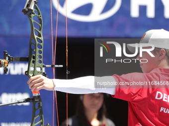 Mathias Fullerton of Denmark competes against James Lutz of the United States (not in picture) during the men's compound gold medal match on...