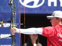 Mathias Fullerton of Denmark competes against James Lutz of the United States (not in picture) during the men's compound gold medal match on...