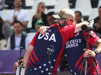 James Lutz of the United States competes against Mathias Fullerton of Denmark (not in picture) during the men's compound gold medal match on...