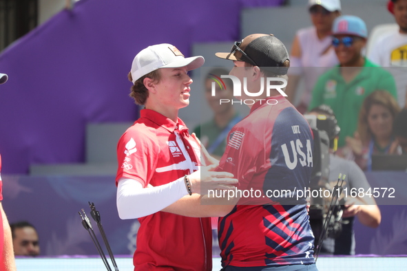 James Lutz of the United States and Mathias Fullerton of Denmark compete during the men's compound gold medal match on the second day of the...