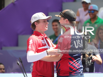 James Lutz of the United States and Mathias Fullerton of Denmark compete during the men's compound gold medal match on the second day of the...