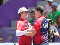 James Lutz of the United States and Mathias Fullerton of Denmark compete during the men's compound gold medal match on the second day of the...