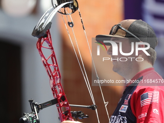 James Lutz of the United States competes against Mike Schloesser of the Netherlands (not in picture) during the men's compound gold medal ma...