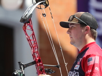 James Lutz of the United States competes against Mike Schloesser of the Netherlands (not in picture) during the men's compound gold medal ma...