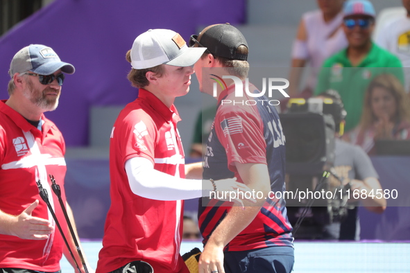 James Lutz of the United States and Mathias Fullerton of Denmark compete during the men's compound gold medal match on the second day of the...