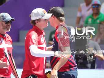 James Lutz of the United States and Mathias Fullerton of Denmark compete during the men's compound gold medal match on the second day of the...