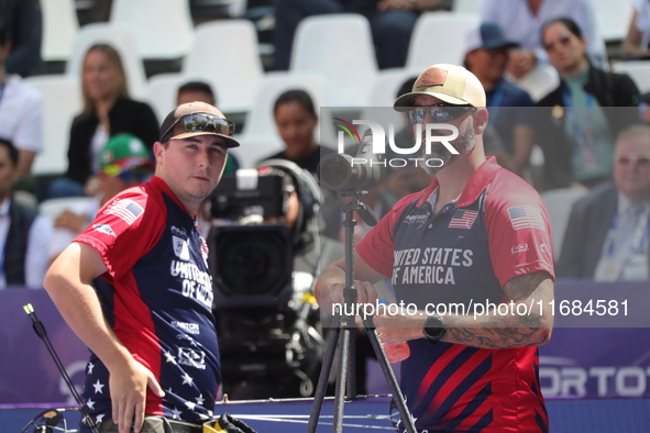 James Lutz of the United States competes against Mathias Fullerton of Denmark (not in picture) during the men's compound gold medal match on...