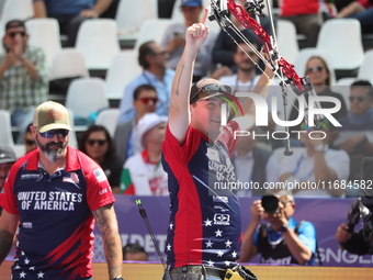 James Lutz of the United States competes against Mathias Fullerton of Denmark (not in picture) during the men's compound gold medal match on...